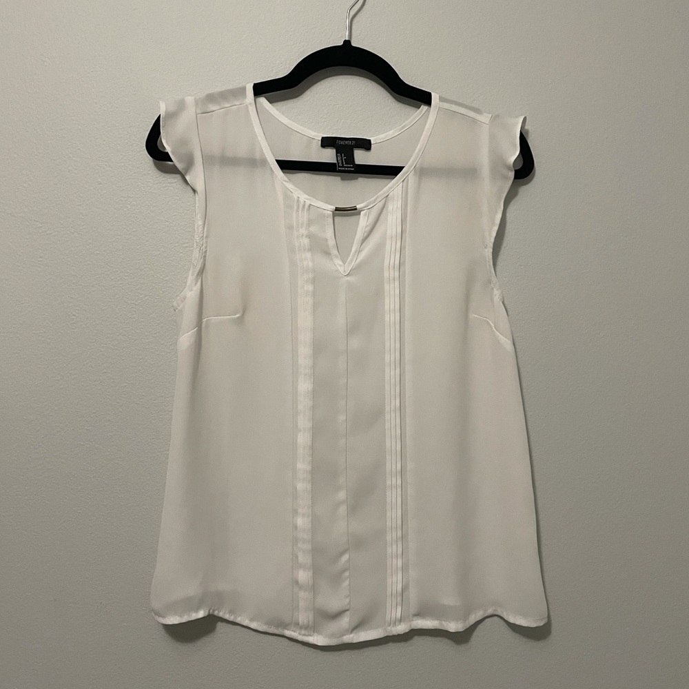 White sleeveless blouse